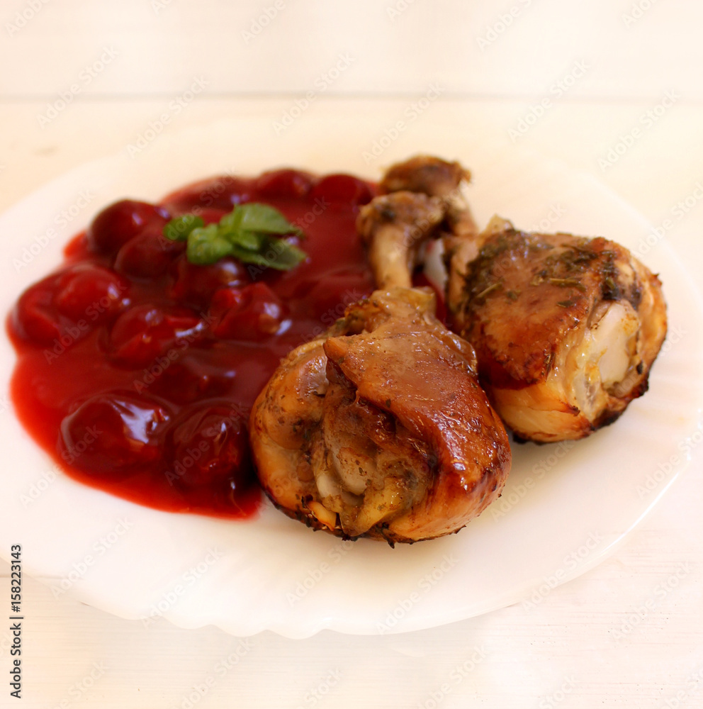 Chicken legs baked with sweet and sour cherry sauce Chicken legs baked with sweet and sour cherry sauce
