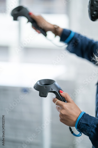 Young woman wearing a virtual reality headset.