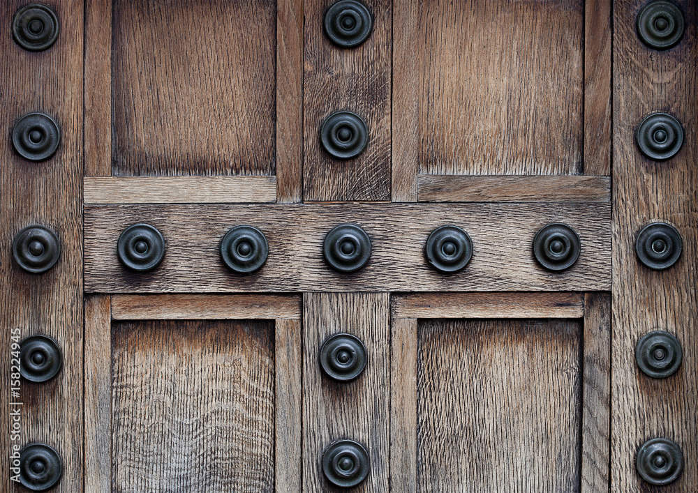 Old wooden door with steel lock and decoration Old wooden door with steel lock and decoration