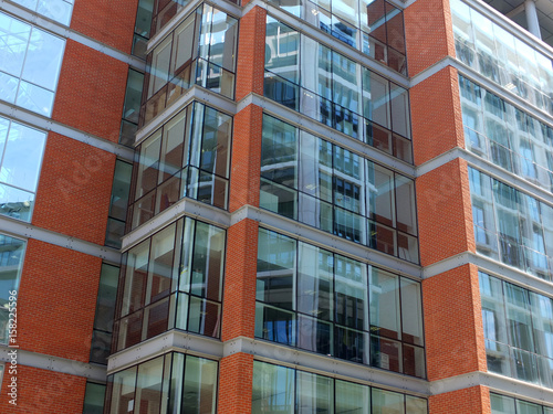 modern office building with brick details and floor to ceiling windows