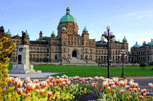 Historic British Columbia provincial parliament building with spring tulips, Victoria, BC, Canada photo