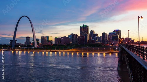 Wallpaper Mural St Louis, Missouri cityscape skyline and Gateway Arch as night falls over downtown (logos blurred for commercial use) Torontodigital.ca
