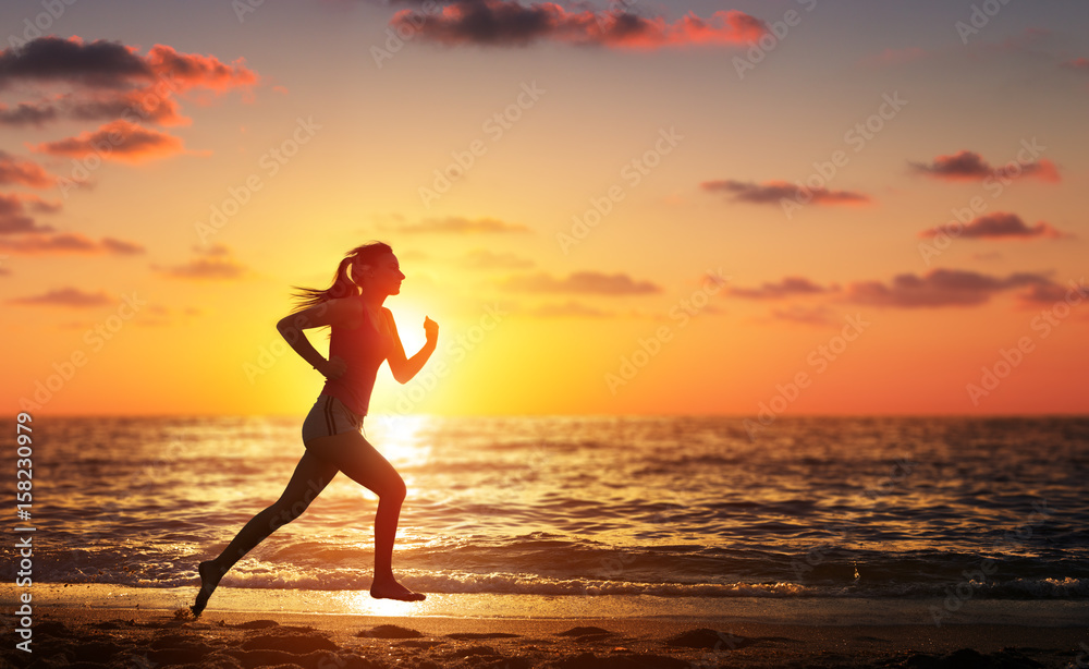 Runner Woman Running In The Beach At Sunset Stock Photo | Adobe Stock