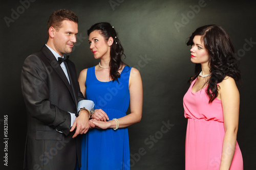 Couple and his jealous woman lover photo