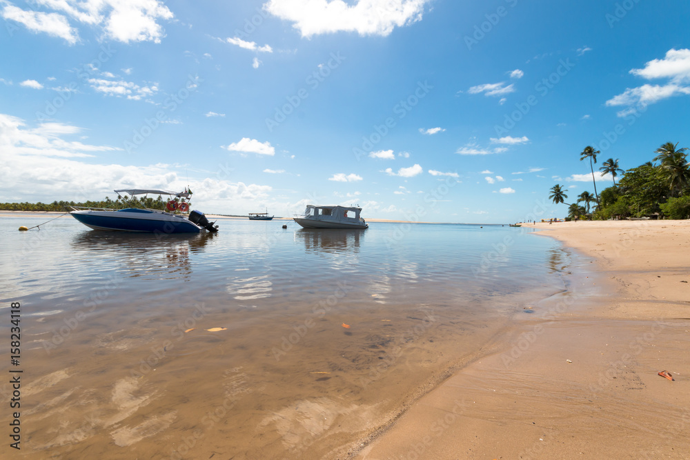 Tropical island paradise with speedboats in calm sea Tropical island paradise with speedboats in calm sea