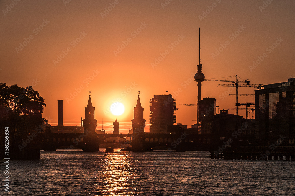 Berlin skyline with sunset sky - river Spree, Oberbaum Bridge, Tv Tower