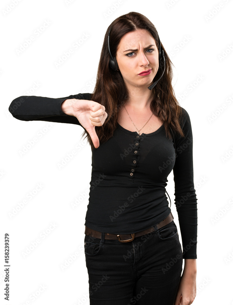 Telemarketer Beautiful young girl making bad signal Telemarketer Beautiful young girl making bad signal