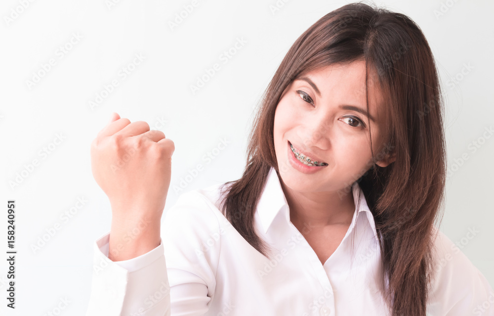 Successful business woman and smiling with arm up