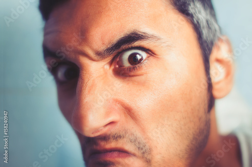 close-up of an angry man looking at the camera