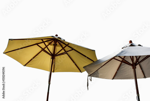 solated two beach umbrellas shot from underneath with copy space.