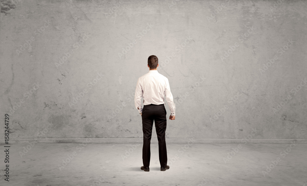 Businessman lost in empty urban space Businessman lost in empty urban space