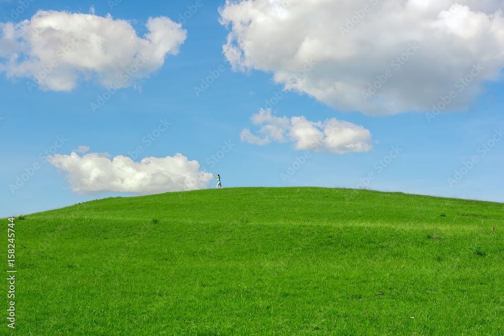 The person pushes the clouds in the sky The person pushes the clouds in the sky
