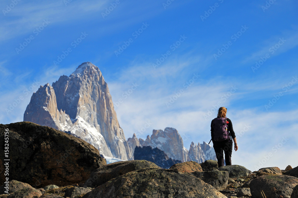 Woman hiking in the mountains, Mount Fitz Roy, El Chalten, Patagonia, Argentina Woman hiking in the mountains, Mount Fitz Roy, El Chalten, Patagonia, Argentina