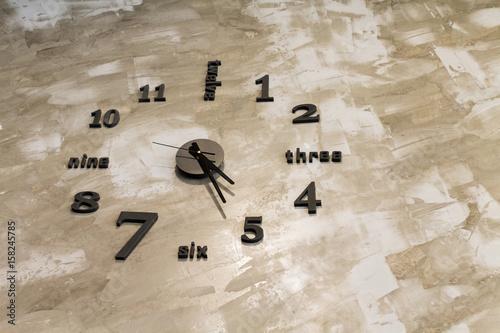 analog clock on cement wall