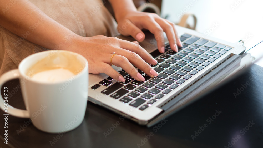 Women's hands typing on computer Women's hands typing on computer