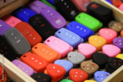 Colorful cover keys for cars on each cover at the market - selective focus
