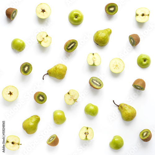 Fruits on a white background. Pattern of fruits. Food background. Collage of food. Top view. Composition from pears, green apples, kiwi.