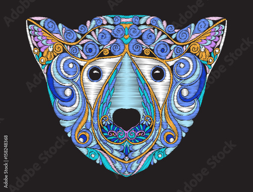 Embroidery ethnic patterned ornate head of polar bear. 