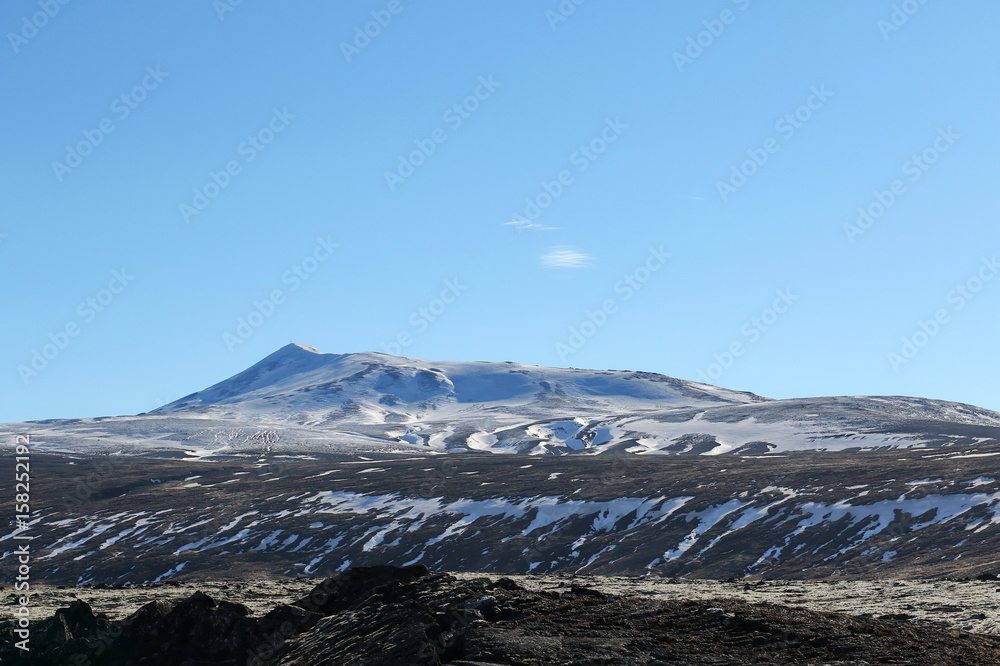 Mountains with snow in spring, east of Iceland