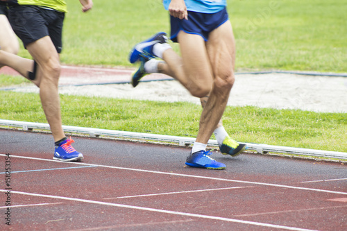 athletes running on the athletics track