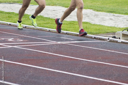 athletes running on the athletics track