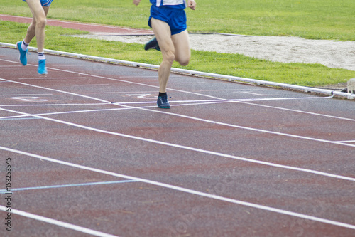 athletes running on the athletics track
