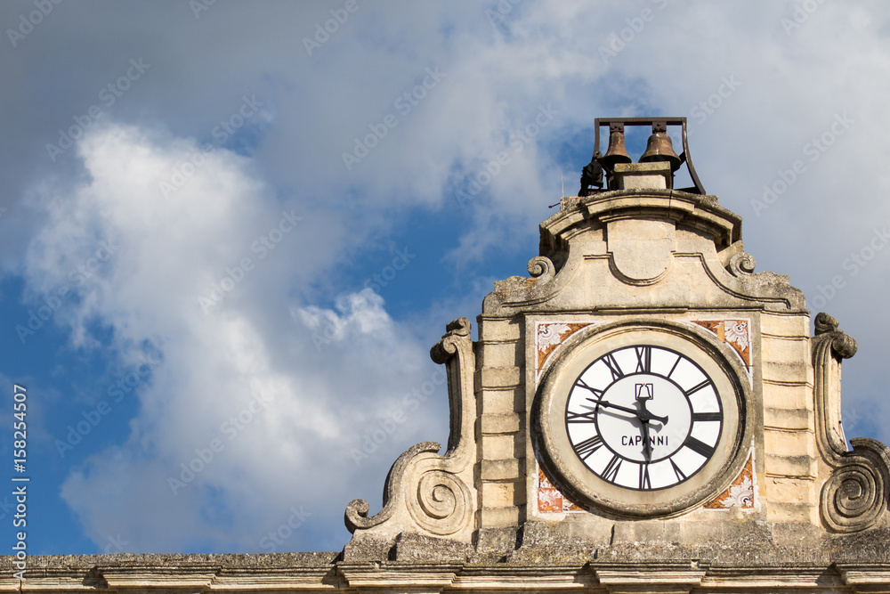 Matera, Italy - May 20, 2017: Clock and bell on a roof of a church in the city