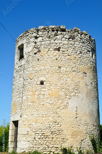 Abandoned windmill tower photo