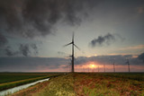 windmill turbines at sunset