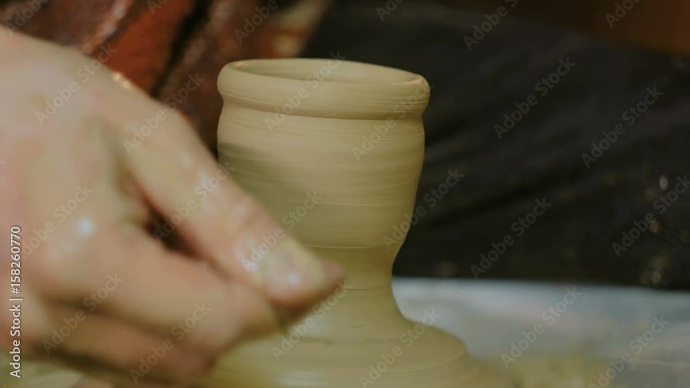 Professional male potter working in workshop, studio. Handmade, small business, crafting work concept Professional male potter working in workshop, studio. Handmade, small business, crafting work concept