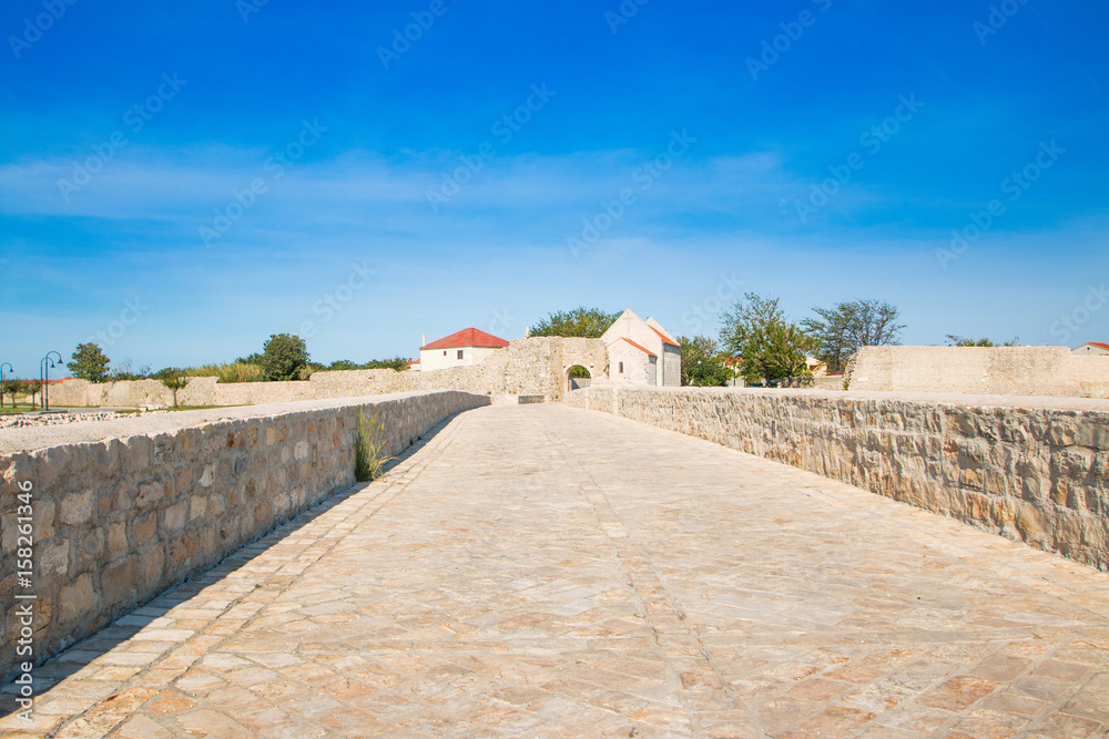     Dalmatian landscape, stone bridge in town of Nin, Dalmatia, Croatia 