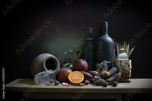 Fototapeta Naklejka Na Ścianę i Meble -  Objects expired and dried and rotten fruits on the plank in dim light night / Still life style  and select focus .