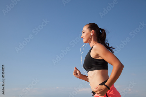 girl runs sports and listening to music