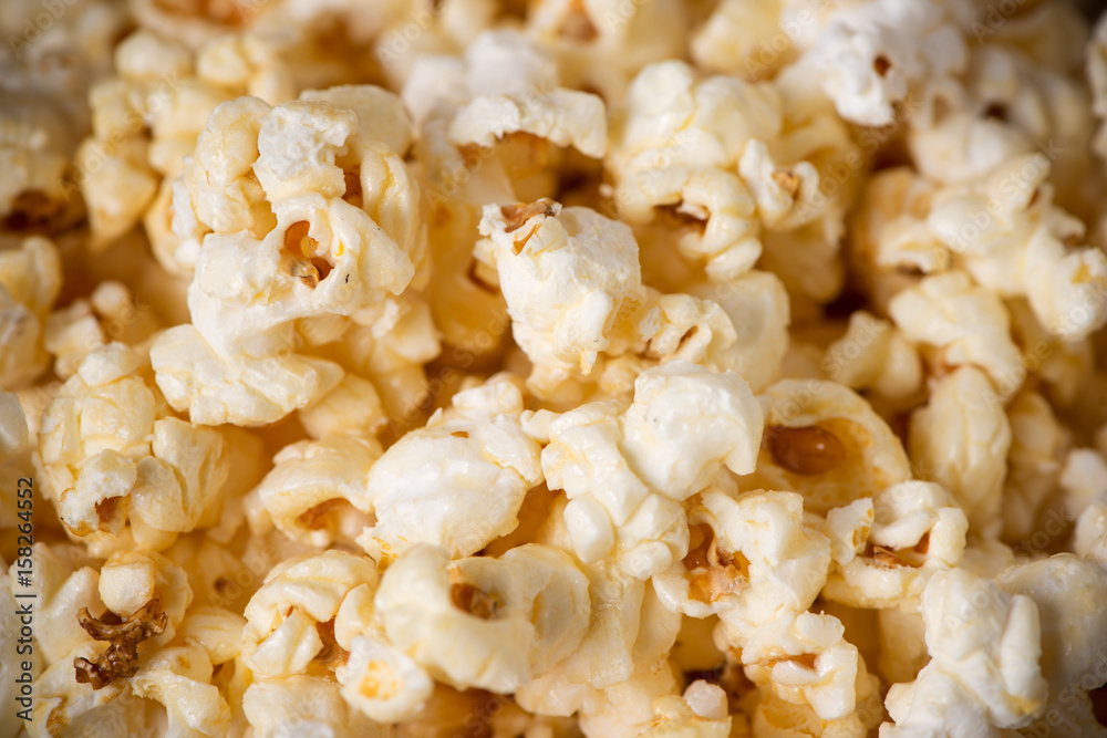 Popcorn in bowl on the wooden table, selective focus Popcorn in bowl on the wooden table, selective focus