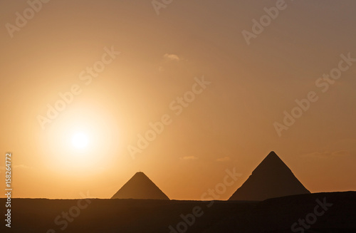 landscape with two pyramids at sunrise