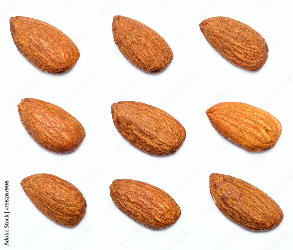 almond isolated on the white background, close up group of healthy nuts almonds. almond isolated on the white background, close up group of healthy nuts almonds.
