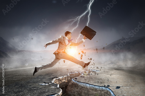 Businessman trying to overcome deep break