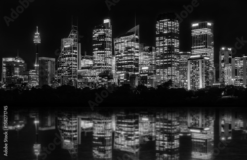 Photography Sydney Waterfront at night seen from Farm Cove, with reflections in bay's water