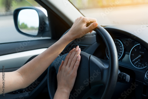 closeup of woman hands behind the wheel. concept of lifestyle.