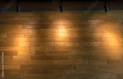 Empty wooden wall background with 3 halogen lamp