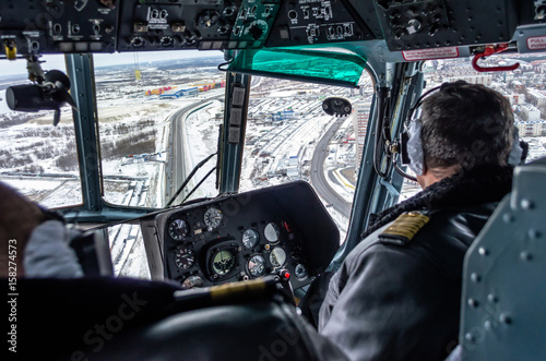 Helicopter mi-8 inside cockpit in flight, Russia, Tyumen November 2013. photo