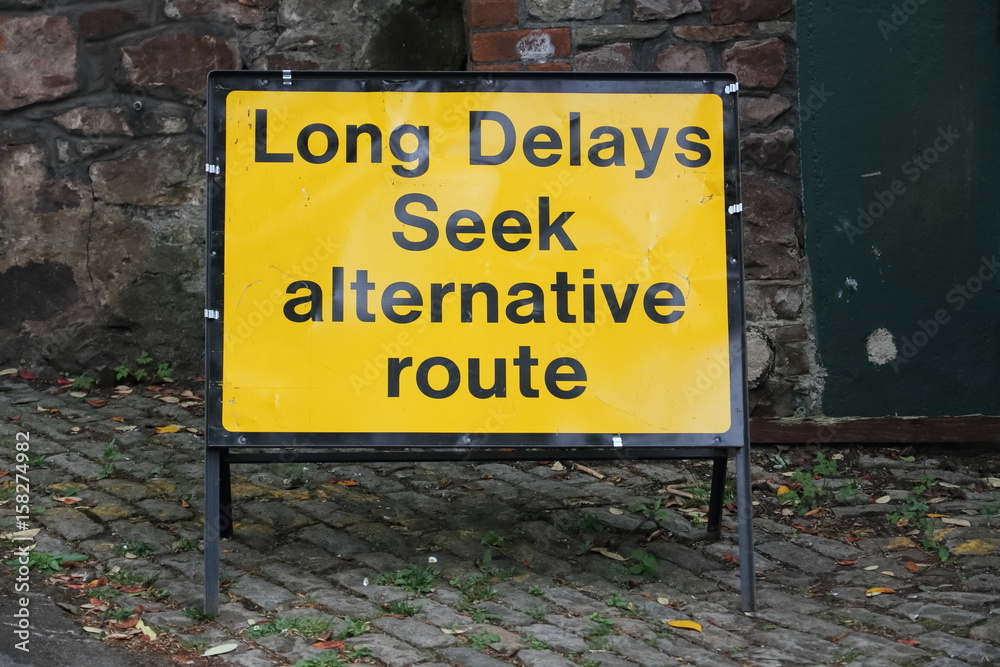 Sign: Long Delays Seek alternative route