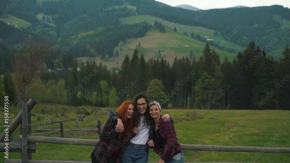 Girls tourists have fun in valley. Girls tourists have fun in valley.