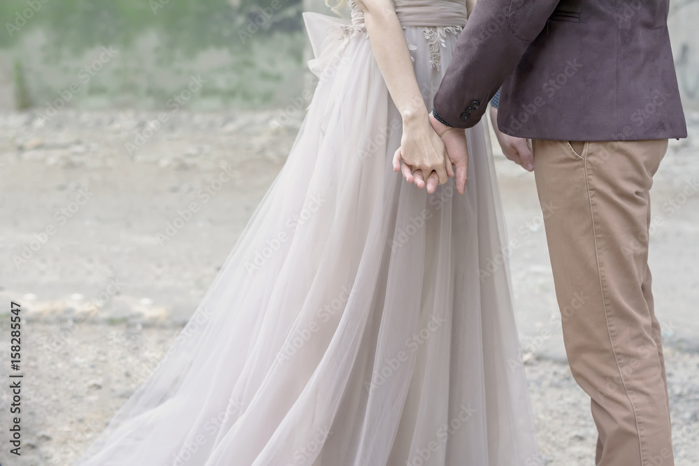 Wedding couple holding hands, loft style wedding Wedding couple holding hands, loft style wedding
