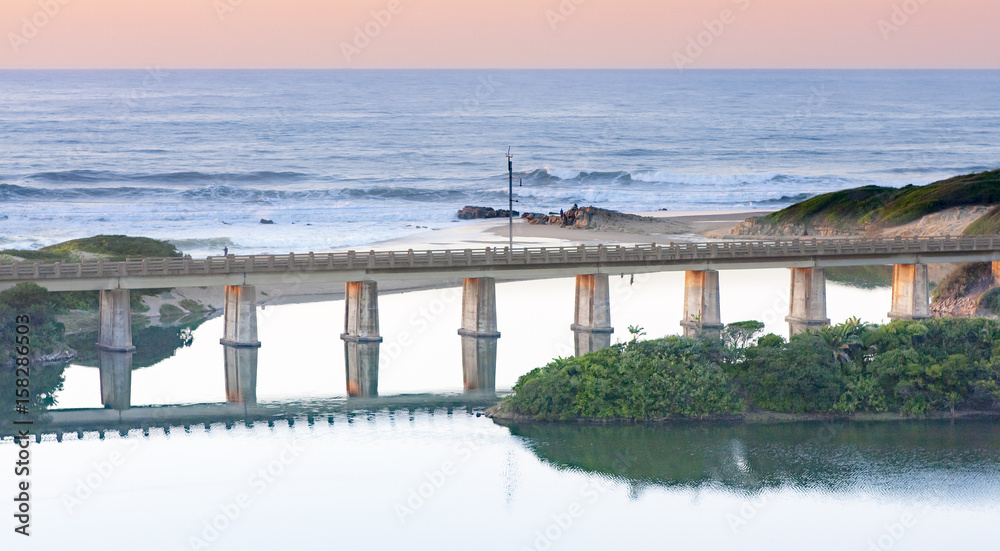 Reflection of a railway bridge crossing a lagoon on the KZN South Coast of South Africa. Reflection of a railway bridge crossing a lagoon on the KZN South Coast of South Africa.
