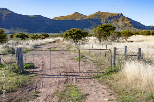 Farm gate and mountain in the Eastern Cape region of South Africa, near to Cradock. photo