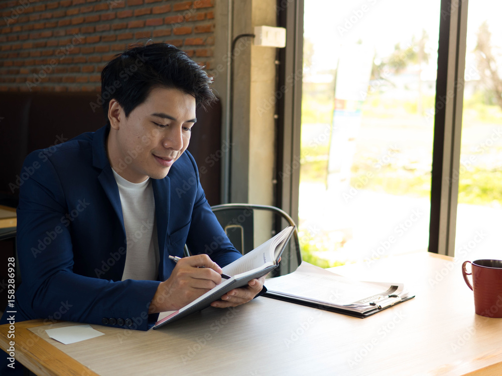 Business man working with notebook Business man working with notebook