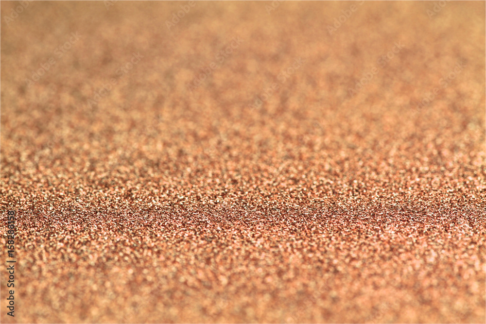 Shiny brown glitter paper defocused texture background. Shiny brown glitter paper defocused texture background.