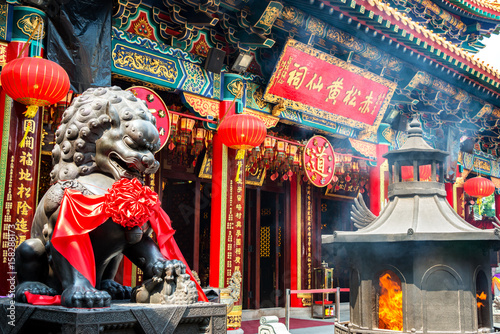 Burning incense in Wong Tai Sin Temple in Hong Kong