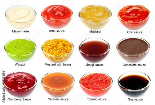 Set of different sauces with names on white background